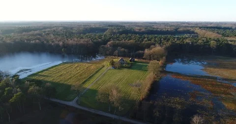 Flooded fields and farm house at dusk Stock Footage 87125431