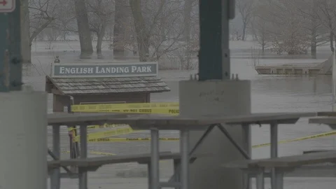 Flooded park with caution tape Stock Footage 105425402