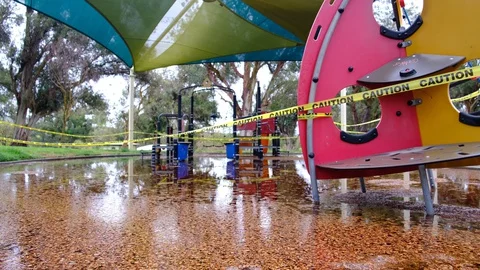 Flooded Playground With Caution Tape Stock Footage 128070990