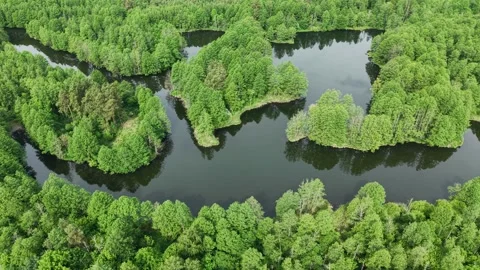Flooded Quarry Basin – High Orbit Right Wide Shot Around Peninsula Formation Video stock 336098128