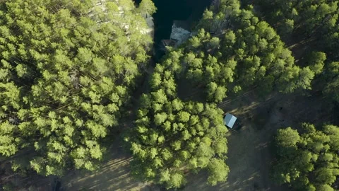Flooded quarry in shape of a heart surrounded by forest, talcov stone, Ural Stock Footage 165330373