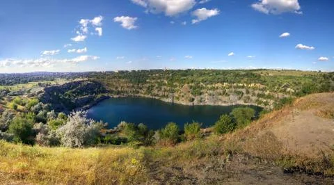 Flooded quarry in summer Stock Photos