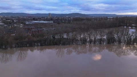 Flooded river landscape with submerged trees and distant city skyline under.. Stock Footage 269852491