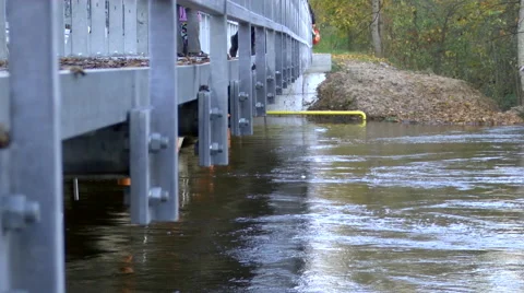 Flooded River With Strong Currents Under Pedestrian bridge Stock Footage 47245867