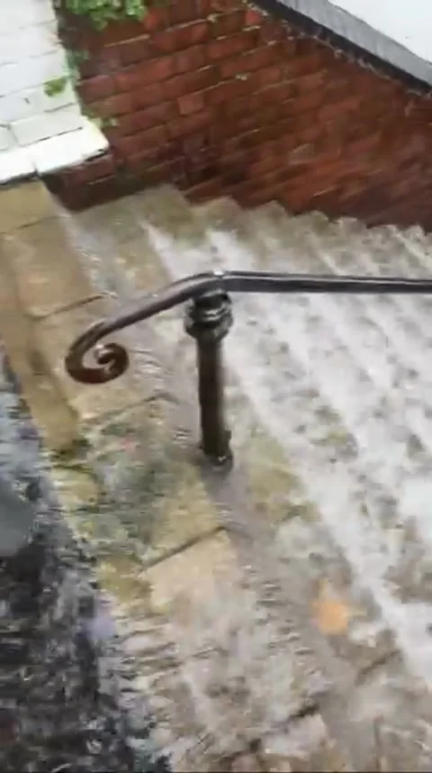 Flooded Road Causes "River Rapids" Down Set of Stairs, Gaswork Steps, Hastings,  Stock Footage 318244073