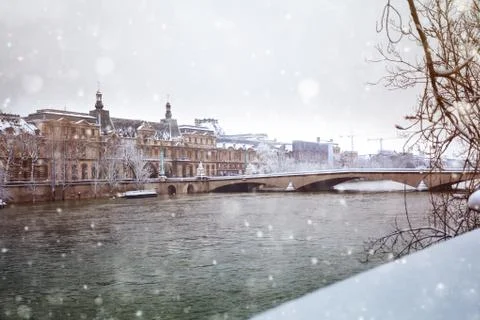 Flooded Seine river in Paris downtown under snow Stock Photos