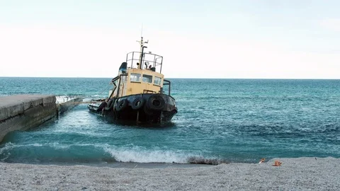 Flooded ship off the coast. Dramatic view of the flooded boat near shore Odessa Stock Footage 110781285