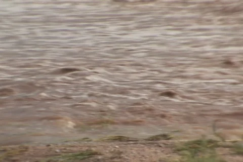 Flooded street and desert after a monsoon storm Stock Footage