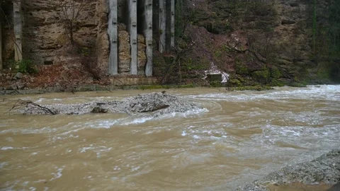 Flooding Alpine river flowing in glacial canyon Stock Footage 144760703