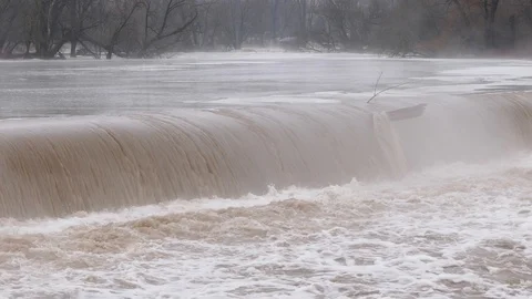 Flooding and fast moving water at New Hamburg Canada Stock Footage 86160847