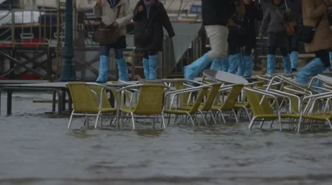 Flooding cafe chairs, st mark's, venice, italy - sea level rise - climate change Stock Footage 45542561