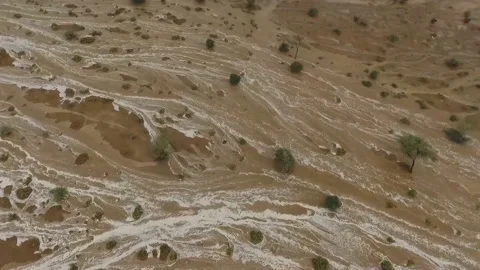 Flooding in a deserted mountainous area, mud flows of water. Saudi Arabia Stock Footage 106654916