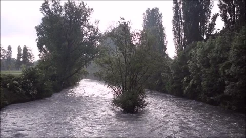 The flooding Dora River flows through a public park in the city of Turin Stock Footage 296173586