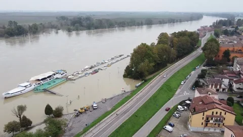 Flooding due to rain and the collapse of the Cadelbosco di Sotto dam, dike Stock Footage 308867675