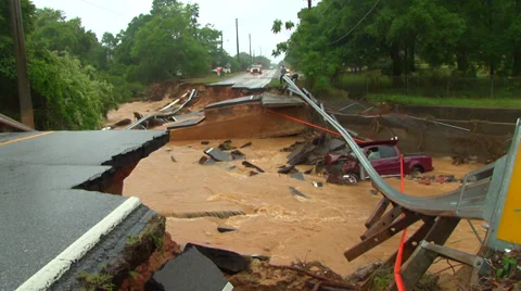 Flooding from record rainfall collapses road Stock Footage 37781905