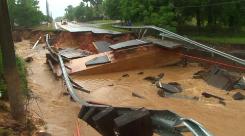 Flooding from record rainfall collapses road Stock Footage 37782077