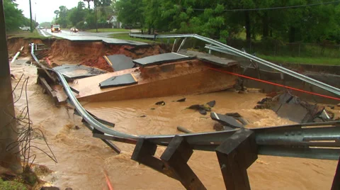 Flooding from record rainfall collapses road Video stock 37782144