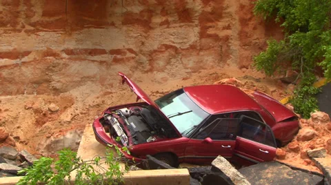 Flooding from record rainfall collapses road Stock Footage 37782961