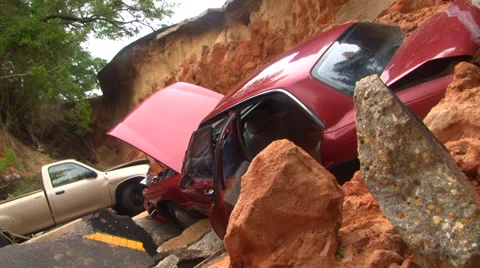 Flooding from record rainfall collapses road Stock-Footage 37783052
