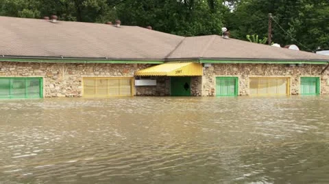 Flooding from record rainfall engulfs a store Stock Footage 12576433