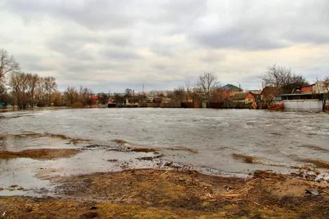 Flooding of river in spring in town during melting of snow. Natural disaster Stock Photos