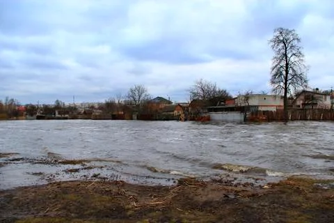 Flooding of river in spring in town during melting of snow. Natural disaster Stock Photos