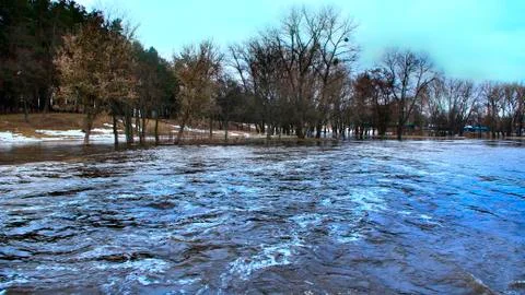 Flooding of river in spring in town during melting of snow. Natural disaster Stock Photos