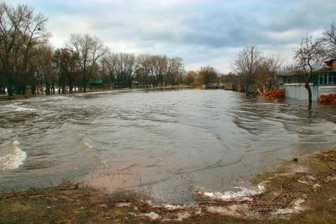 Flooding of river in spring in town during melting of snow. Natural disaster Stock Photos
