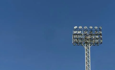 Floodlight in stadium with clear sky background Stock Photos