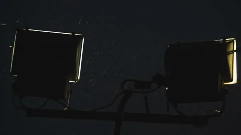 The floodlight tower in the rain at night Stock Footage 63327849
