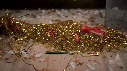 Floor with after a party celebration with empty bottles, gift box and party Stock Footage 231555558