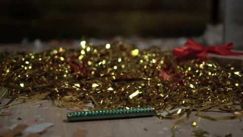 Floor with after a party celebration with empty bottles, gift box and party Stock Footage 231555573