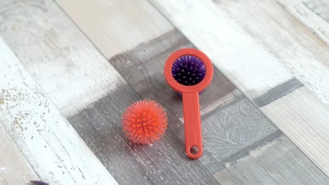 On the floor are two balls with a magnifying glass similar to a virus Stock Footage 128057594