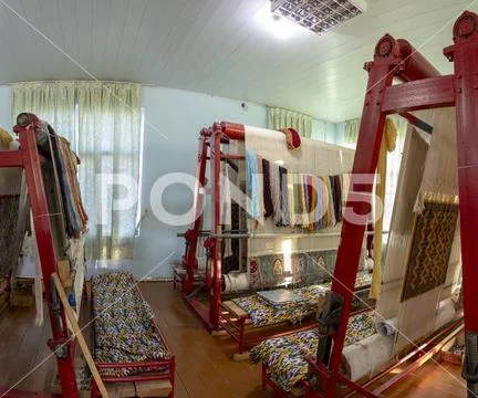 Floor of carpet factory with looms Stock Photos