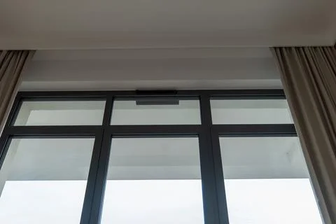 Floor to ceiling window and balcony in modern Gdansk apartment Stock Photos