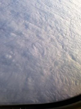Floor of Clouds Out Airplane Window Stock Photos