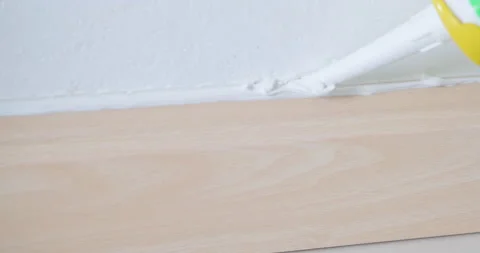 Floor cornice set and repair with glue wood lubmer interior working Stock Footage 148496148