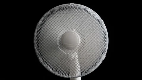 Floor fan spinning on black background loop Stock Footage 345661505