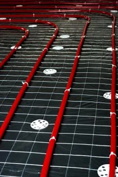 Floor heating pipe. Installation of engineering systems in a building. Stock Photos