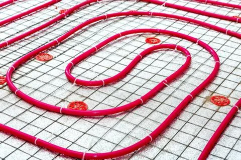 Floor heating pipe. Installation of engineering systems in a building. Stock Photos