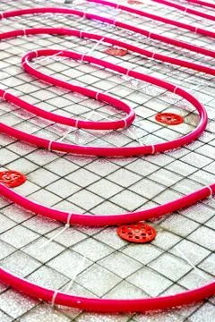 Floor heating pipe. Installation of engineering systems in a building. Fotos de archivo