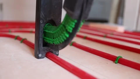 Floor heating stapler tool fixing plastic pipes for underfloor heating Video stock 315507635
