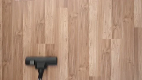The floor of the laminate is vacuumed with a view from above. Stock Footage 150229313