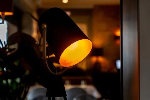 A floor lamp in the form of a lighting device from a film factory with a yell Stock Photos