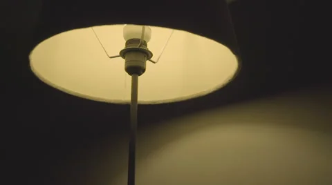 A floor lamp switching off and on Stock Footage 64116102