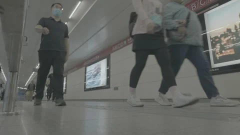 Floor Level View of Walking Commuters in Beijing Subway Vidéo 341456745