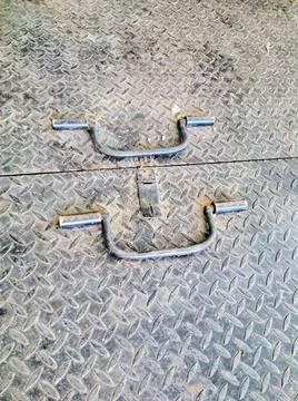 A floor made of iron with a handle Photos