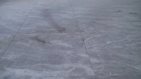 The floor is made of large tiles. The floor is made of large black floor tiles. Video stock 166584487
