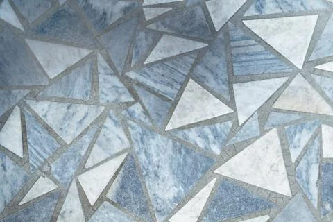 Floor or surface lined with marble slabs of triangular form. 스톡 사진
