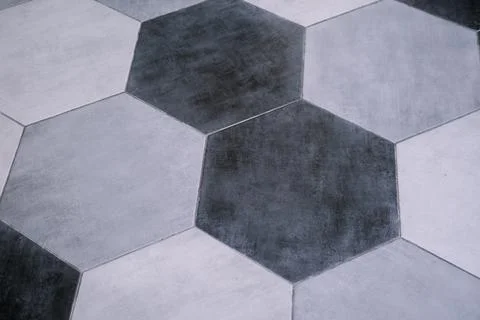 Floor pattern in gray hexagonal tiles Stock Photos